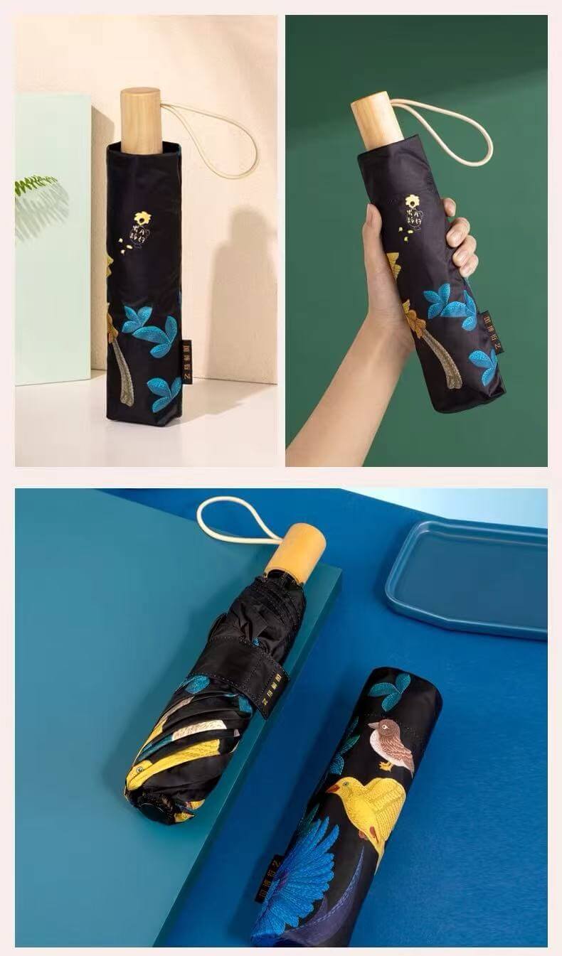 Folded umbrella with its printed sleeve and wooden handle